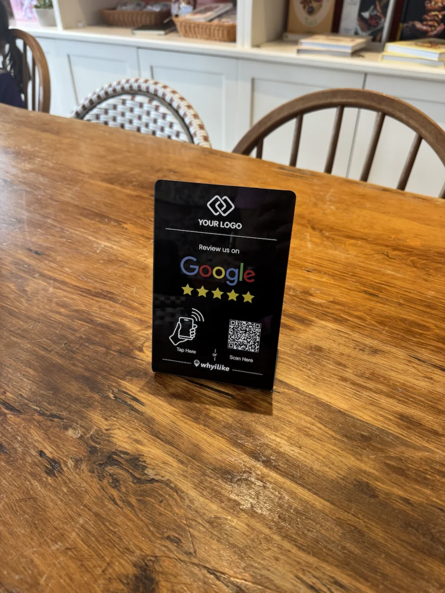 Black custom-logo Google Review Stand on a wood counter